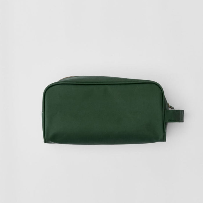 photo of hands holding the Dopp Kit in Hunter Green