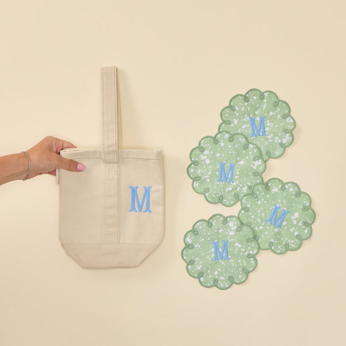 Plain natural canvas wine tote bag and 4 green speckle cocktail napkin with "M" monogram.