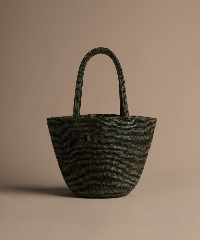 Olive handbag on a beige background