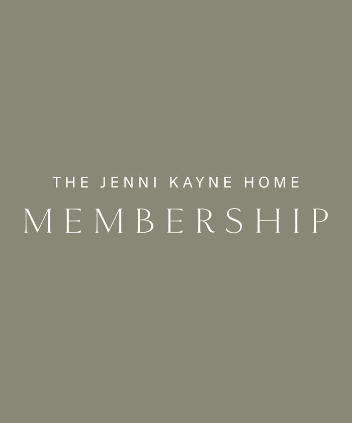 Elegant white uppercase letters display “JKH Membership” against a muted olive-green background.