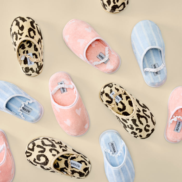 Assorted Weezie kids' slippers in leopard print, coral hearts, and light blue stripes.