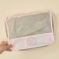 Personalized Tossed Pink Hearts packing cube featuring an embroidered 'CDT' monogram, set against a light background.