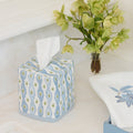 Lee Jofa x Weezie blue and green floral Marciana cotton tissue box cover on a vanity.