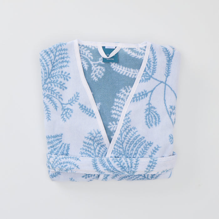Front product shot of the white and light blue floral Lee Jofa Palmero short plush robe.