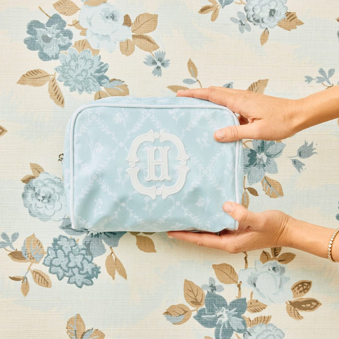 A photo of the small patterned toiletry bag archive in Blue Trellis