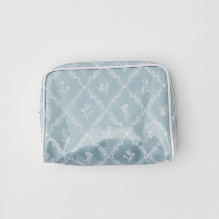 A studio photo of the small patterned toiletry bag archive in Blue Trellis