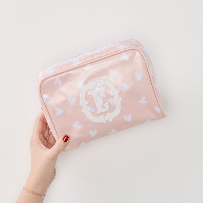 A photo of the small patterned toiletry bag archive in Tossed Pink Hearts