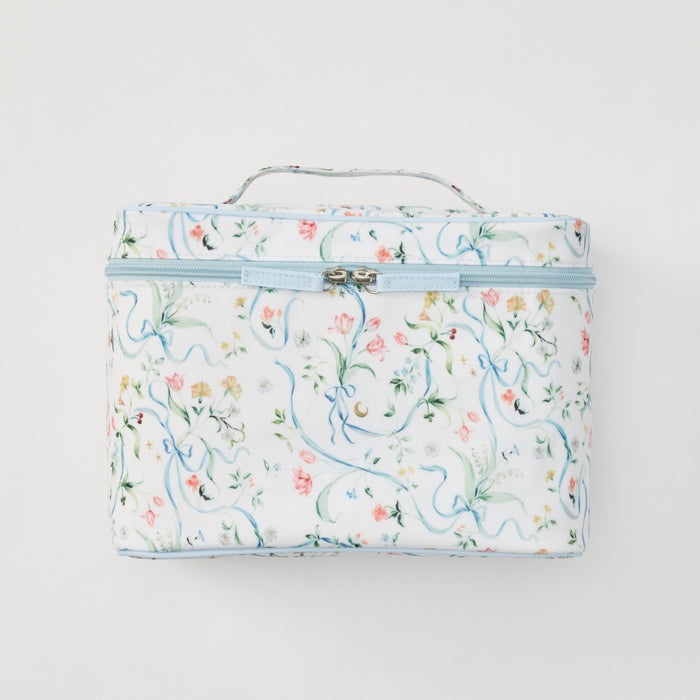 A rectangular zippered case with a top handle, featuring a delicate floral and scroll pattern in soft pastel colors on a white background.