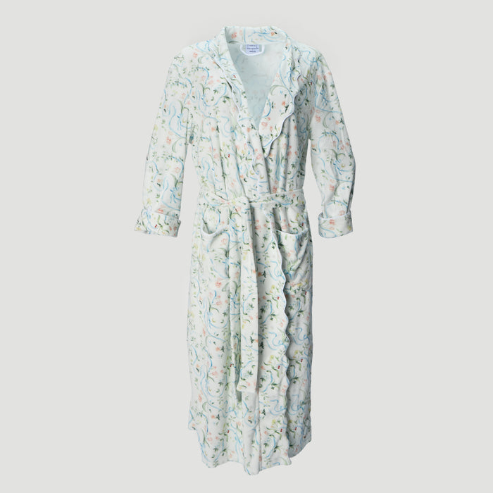 A long-sleeved wrap robe with a matching waist tie, featuring a delicate paisley and floral pattern in soft pastel shades of green, pink, and blue on a white base, shown against a light gray background.