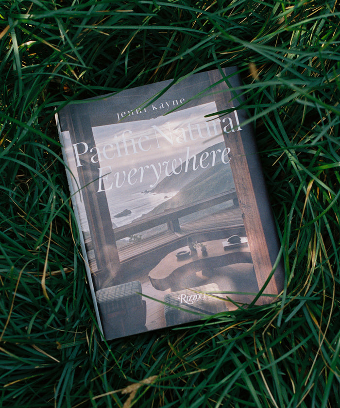 Book titled 'Pacific Natural Everywhere' by Jessi Kayne lying on grass