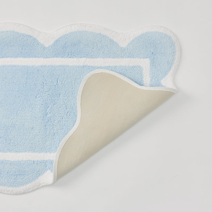 Soft mist blue scalloped bath runner featuring crisp white trim