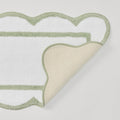 Laurel green scalloped bath runner with crisp white trim.