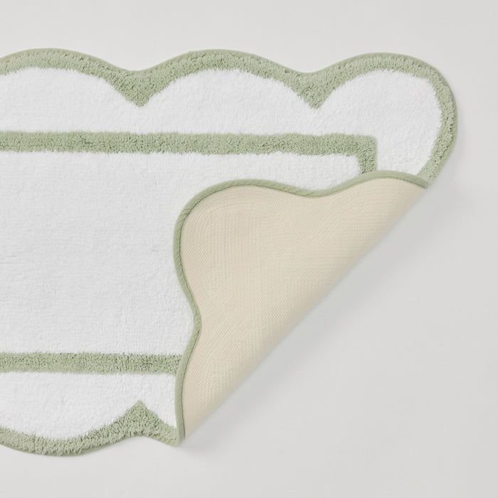 Laurel green scalloped bath runner with crisp white trim.