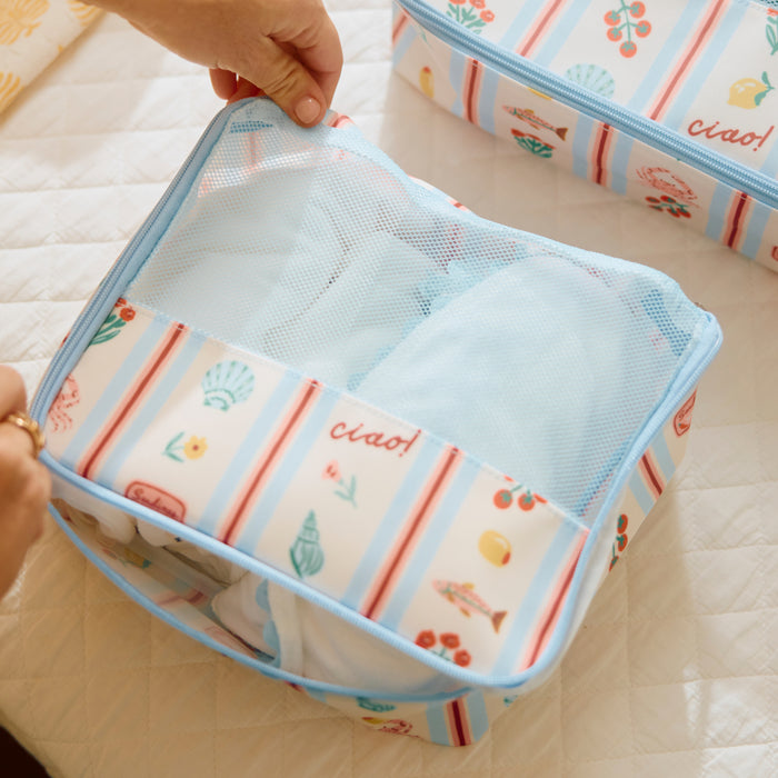 Small Dolce Vita packing cube with breathable mesh top for organized travel packing.