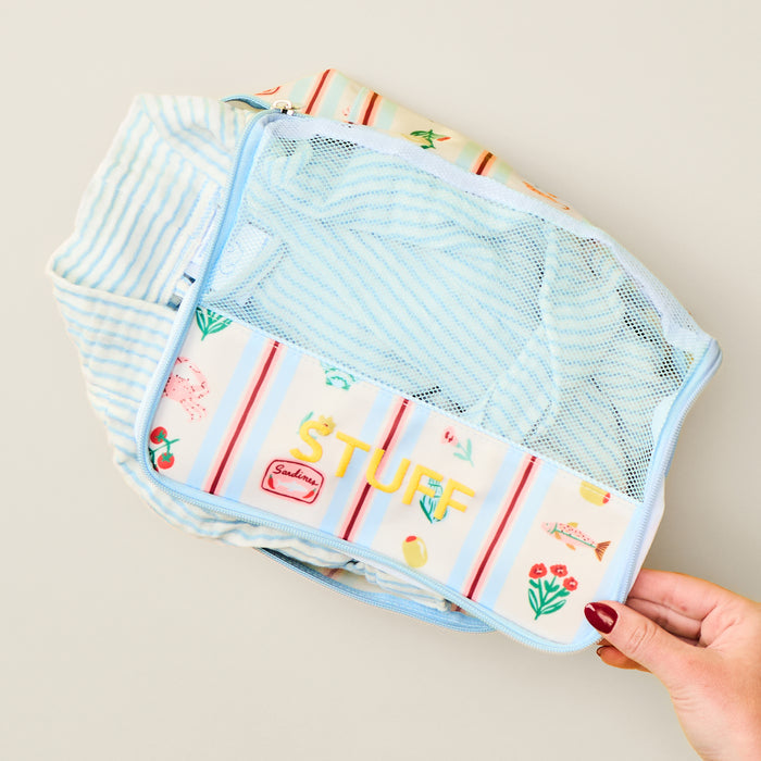 Small Dolce Vita packing cube with breathable mesh top for organized travel packing.