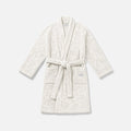 White textured bathrobe with belt and two front pockets for cozy homewear.