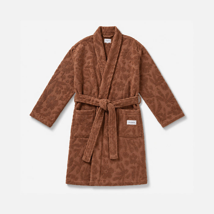 Plush brown patterned robe with belt and front pockets.