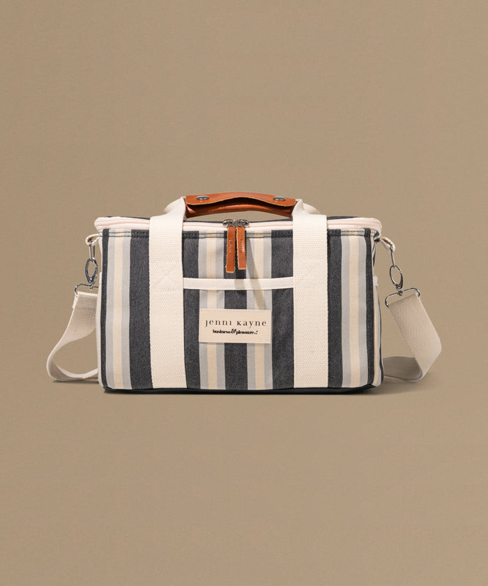 Striped bag with a visible brand label on a beige background