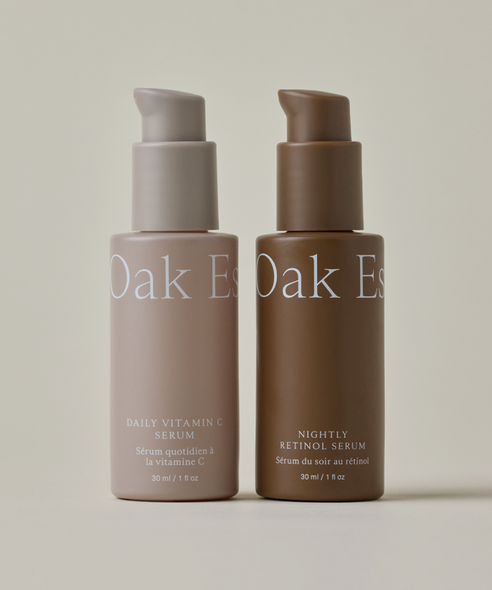 The Serums by Oak Essentials—Daily Vitamin C and Nightly Retinol, each in 30 ml pump bottles—sit on a neutral background, perfect for your skincare routine.
