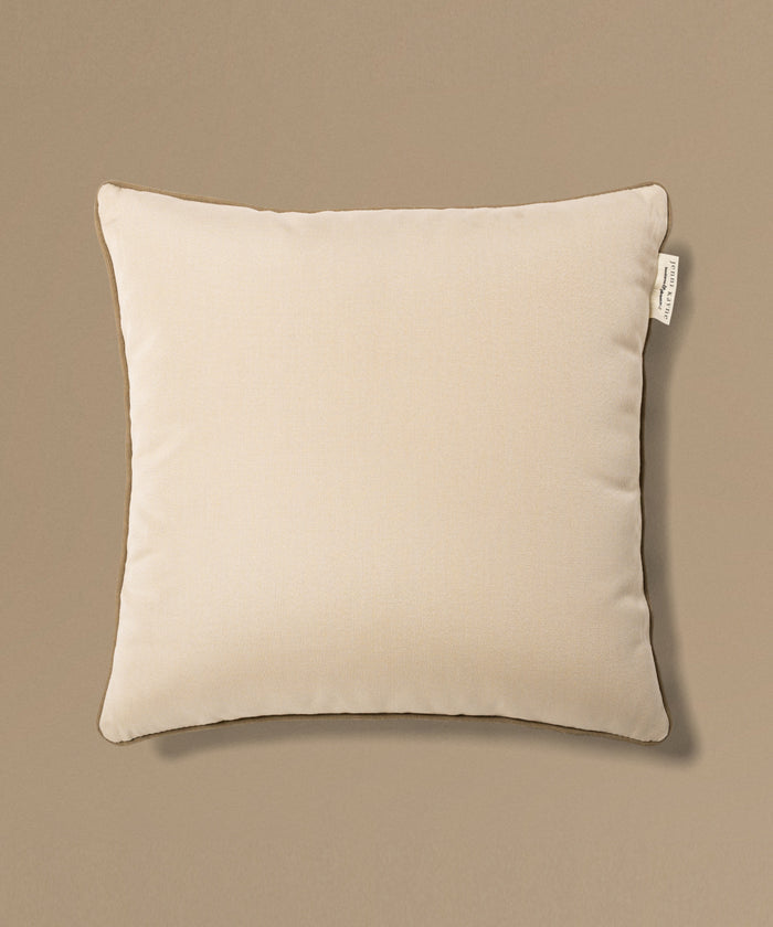Beige pillow with a tag on a beige background