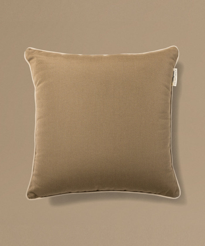 Brown pillow on a beige background