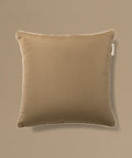 Brown pillow on a beige background