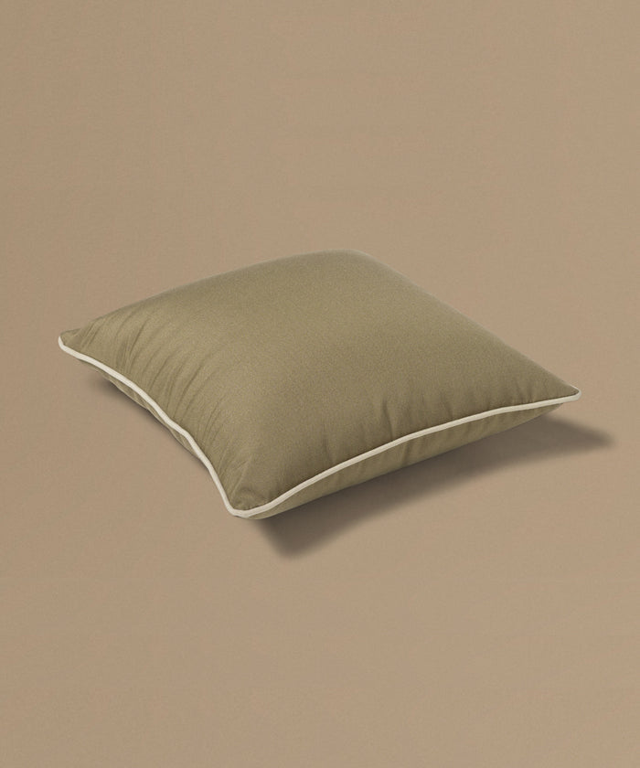 Brown pillow on a beige background
