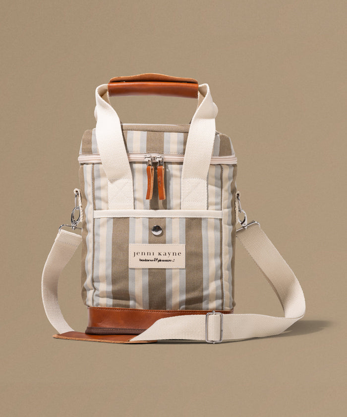 Stripped bag with leather accents on a beige background