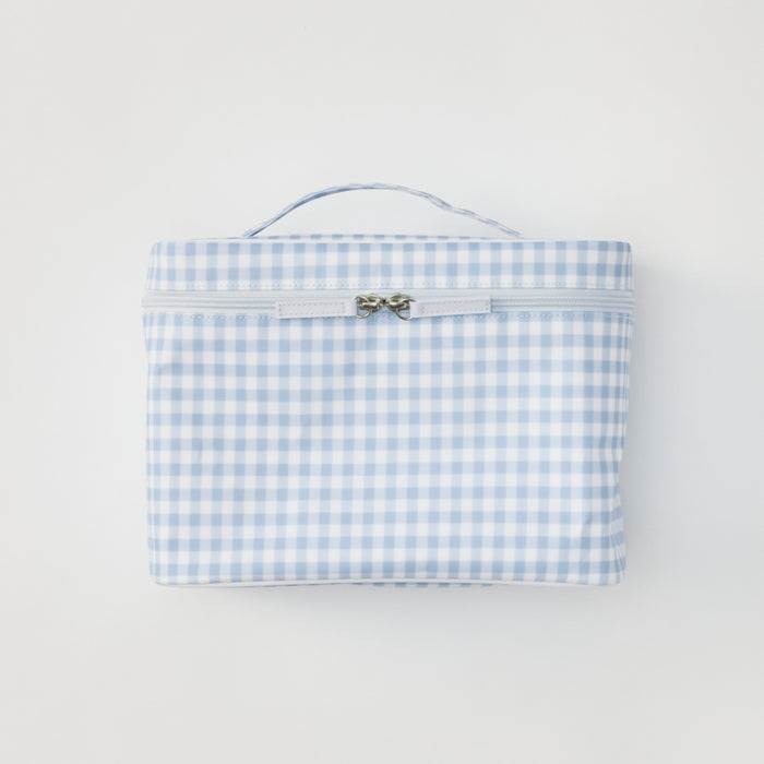 A light blue gingham print vanity case shown from a straight-on, front-facing view against a neutral background. The case features a sturdy top handle and a zippered closure with two silver pulls.