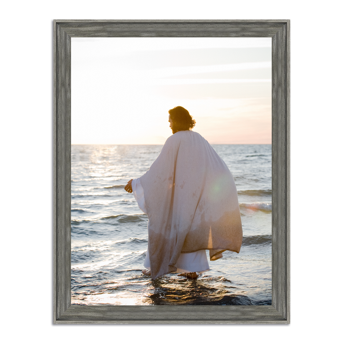 Jesus walking on water at sunset, viewed from behind, white robe with deliberate splashes around his feet. Original photograph by Mark Mabry.