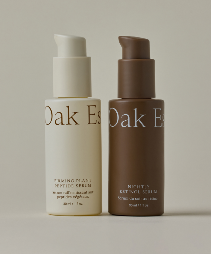 The Youthful Skin Serum Duo includes a cream-colored Firming Plant Peptide Serum for hydration and a brown Nightly Retinol Serum for wrinkle reduction. Both 30 ml bottles feature pump dispensers for easy use.